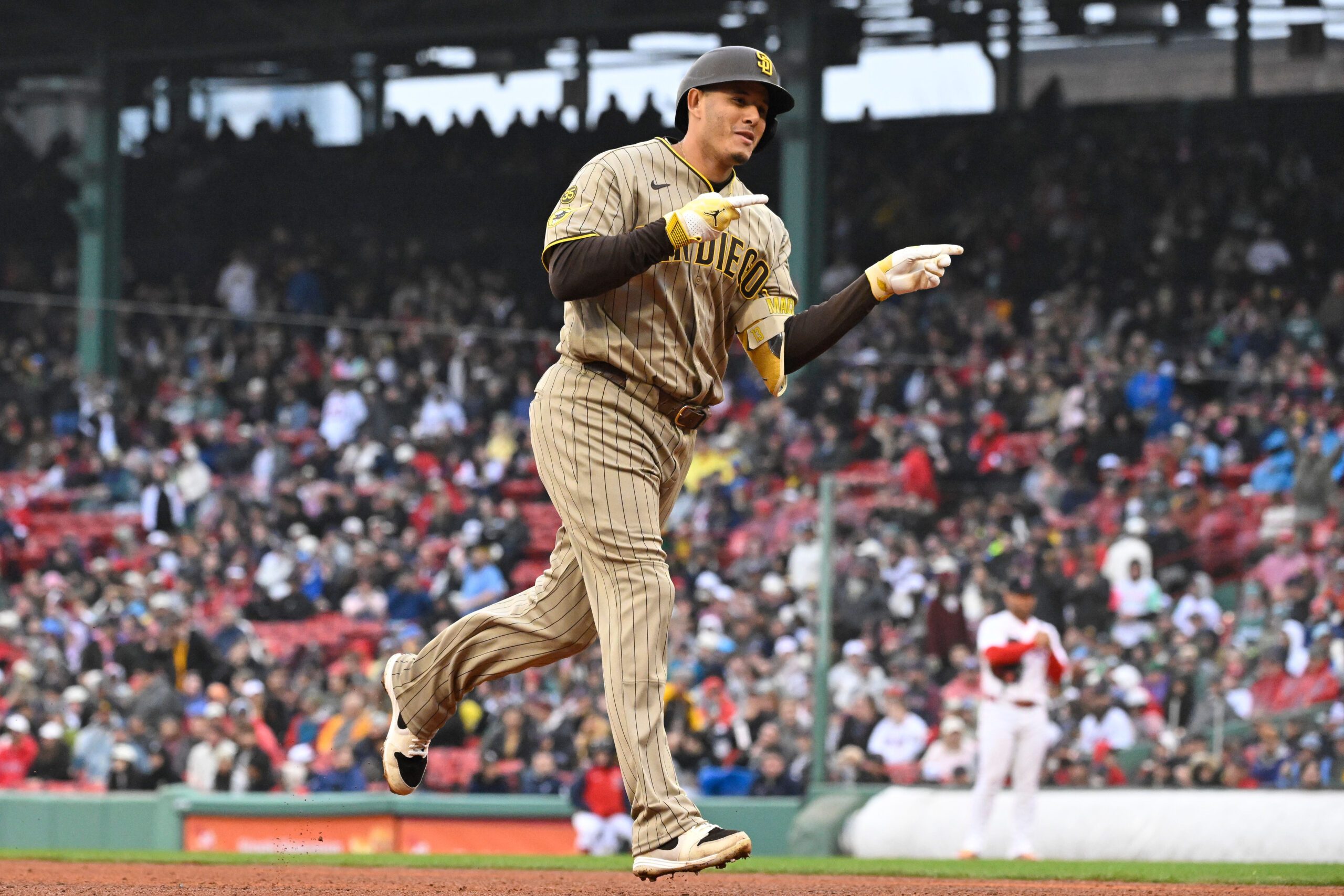 Apr 5, 2026; Boston, Massachusetts, USA; San Diego Padres third baseman Manny MacHado (13) celebrates his three run home run against the Boston Red Sox during the fifth inning at Fenway Park. Mandatory Credit: Eric Canha-Imagn Images