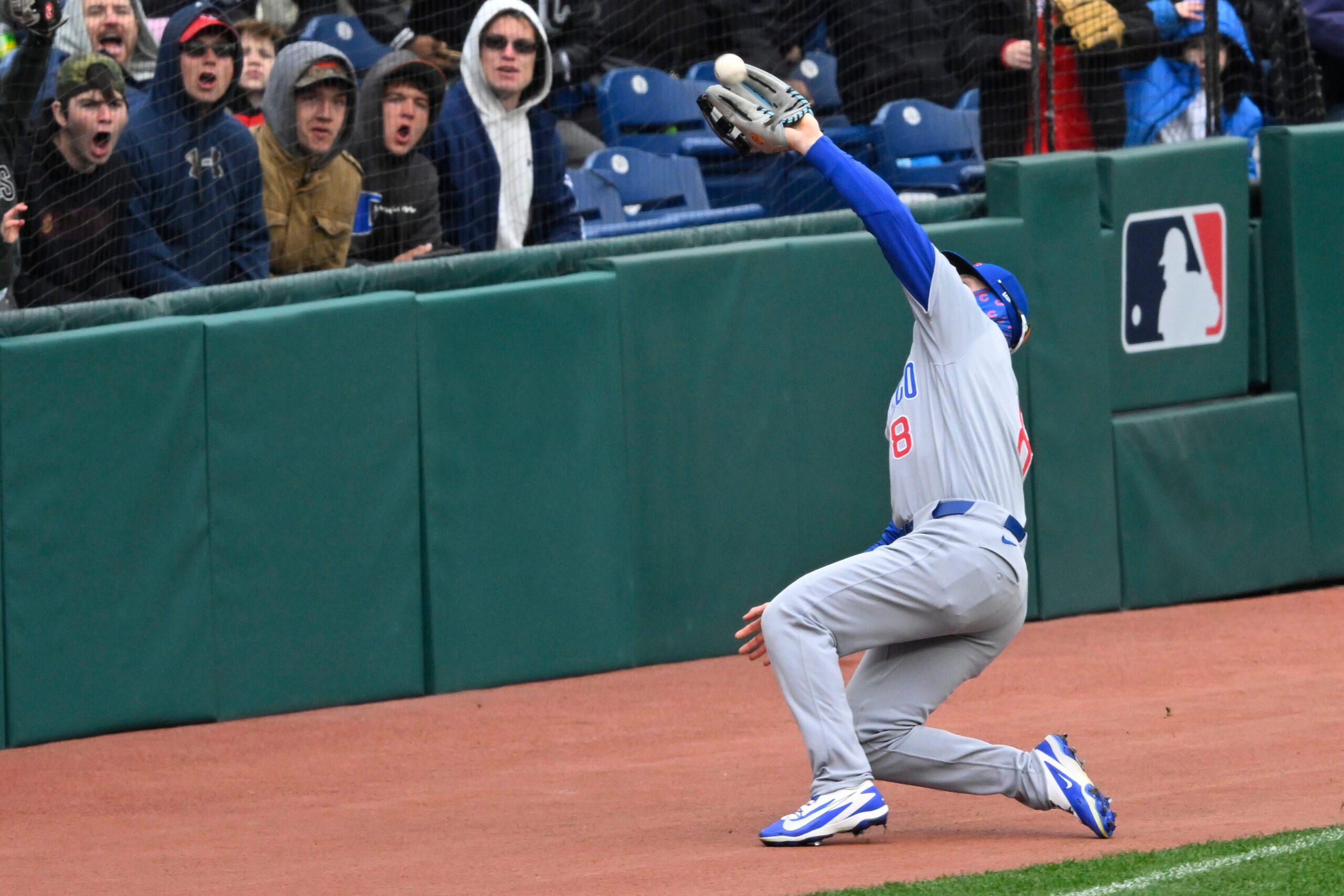 Apr 5, 2026; Cleveland, Ohio, USA; Chicago Cubs left fielder Ian Happ (8) catches a foul ball in the seventh inning against the Cleveland Guardians at Progressive Field. Mandatory Credit: David Richard-Imagn Images