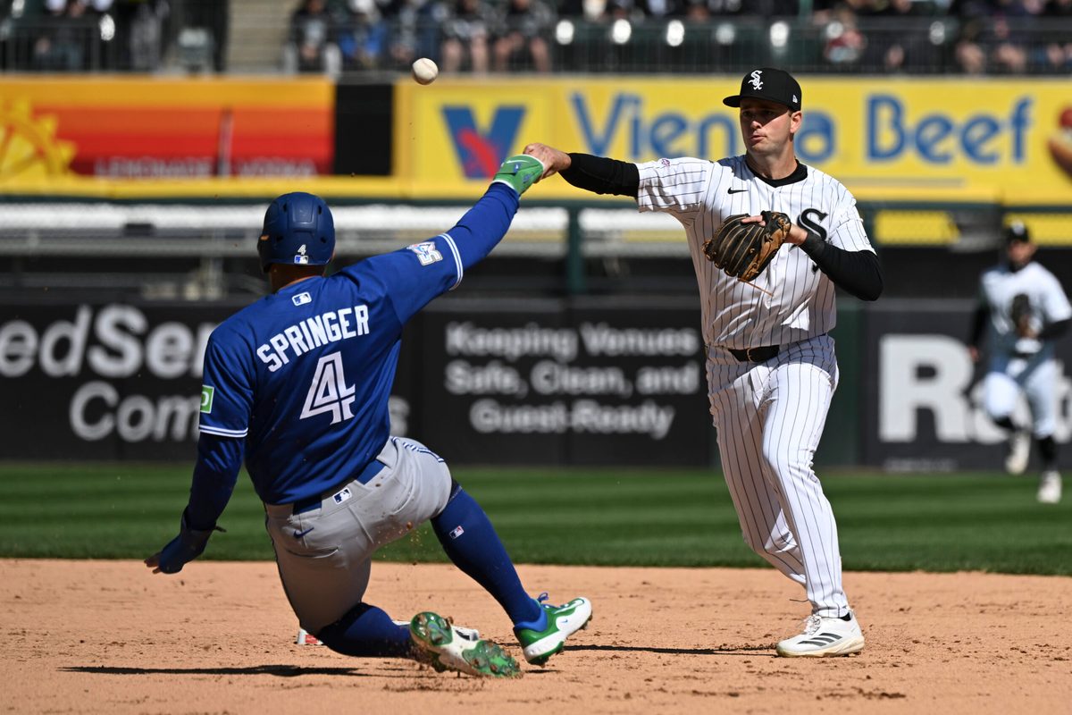 Apr 5, 2026; Chicago, Illinois, USA; Chicago White Sox shortstop Tanner Murphy throws a double play after forcing out Toronto Blue Jays right fielder George Springer (4) during the fifth inning at Rate Field. Mandatory Credit: Matt Marton-Imagn Images