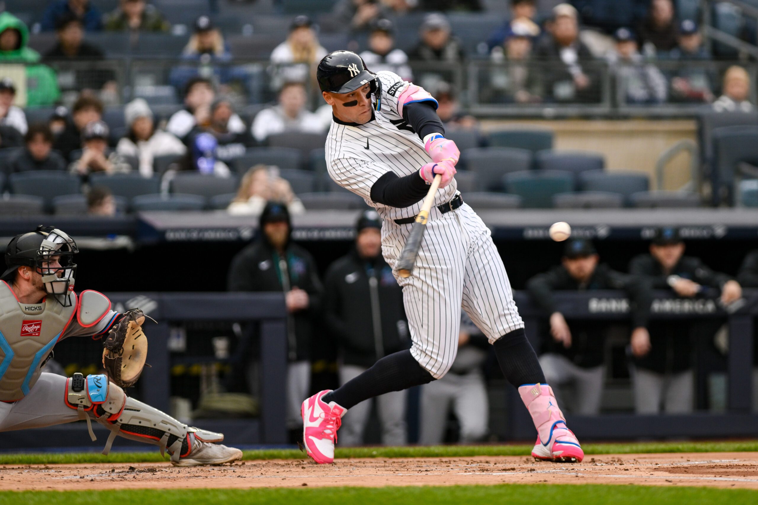Apr 5, 2026; Bronx, New York, USA; New York Yankees right fielder Aaron Judge (99) hits a single against the Miami Marlins during the first inning at Yankee Stadium. Mandatory Credit: John Jones-Imagn Images