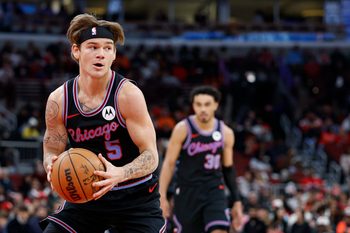 Apr 5, 2026; Chicago, Illinois, USA; Chicago Bulls guard Mac McClung (5) looks to pass the ball against the Phoenix Suns during the first half at United Center. Mandatory Credit: Kamil Krzaczynski-Imagn Images