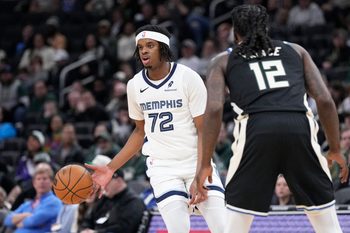Apr 5, 2026; Milwaukee, Wisconsin, USA; Memphis Grizzlies forward Adam Bal brings the ball up the court against Milwaukee Bucks forward Taurean Prince (12) at Fiserv Forum. Mandatory Credit: Michael McLoone-Imagn Images