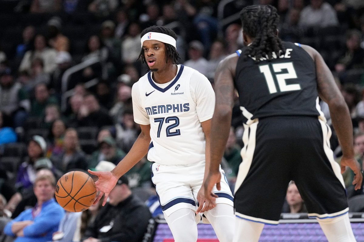 Apr 5, 2026; Milwaukee, Wisconsin, USA; Memphis Grizzlies forward Adam Bal brings the ball up the court against Milwaukee Bucks forward Taurean Prince (12) at Fiserv Forum. Mandatory Credit: Michael McLoone-Imagn Images