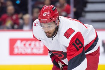 Apr 5, 2026; Ottawa, Ontario, CAN; Carolina Hurricanes defenseman K'Andre Miller (19) gets in position for a faceoff in the first period against the Ottawa Senators at the Canadian Tire Centre. Mandatory Credit: Marc DesRosiers-IMAGN Images