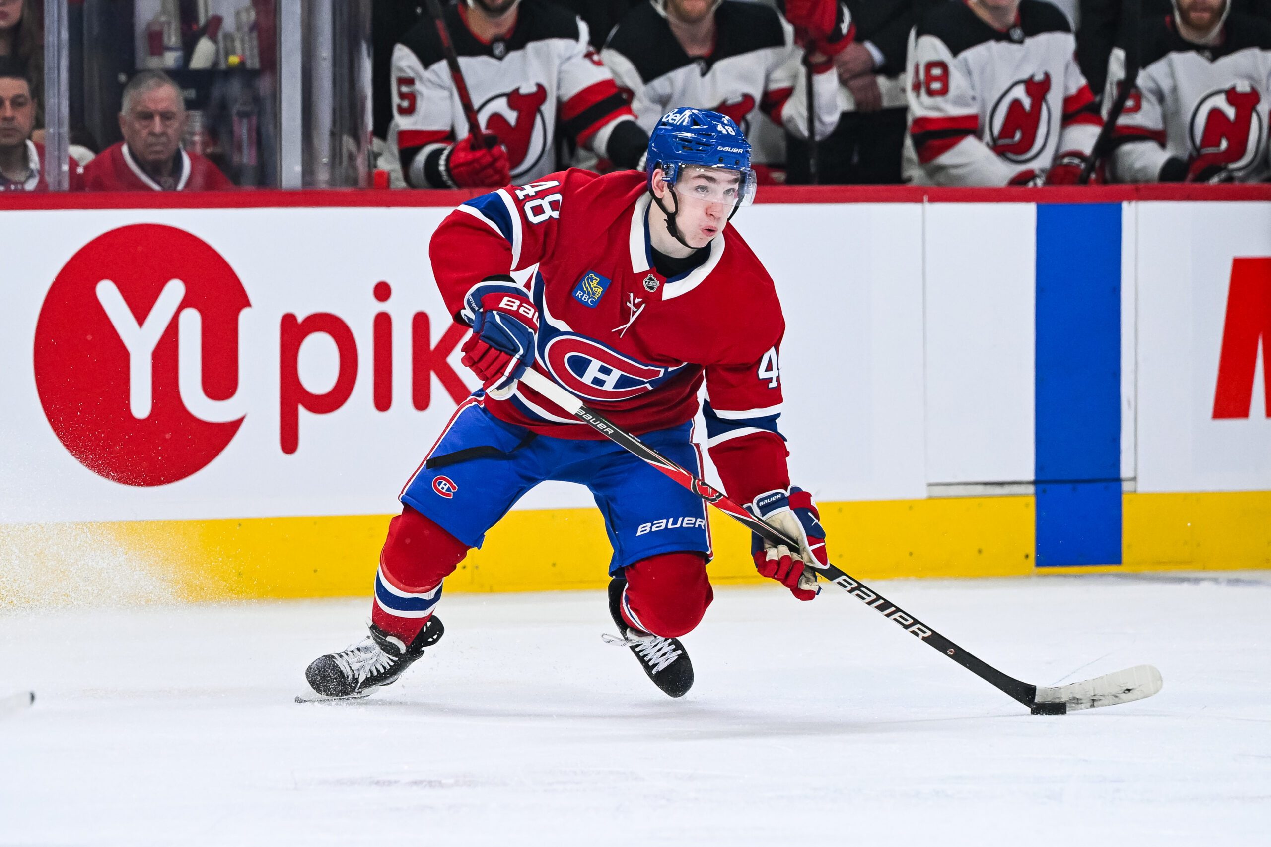 Apr 5, 2026; Montreal, Quebec, CAN; Montreal Canadiens defenseman Lane Hutson (48) plays the puck against the New Jersey Devils during the third period at Bell Centre. Mandatory Credit: David Kirouac-Imagn Images