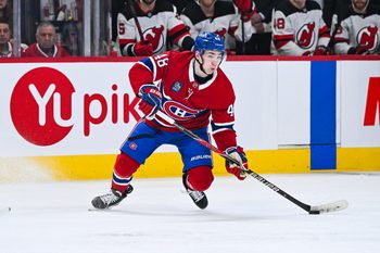 Apr 5, 2026; Montreal, Quebec, CAN; Montreal Canadiens defenseman Lane Hutson (48) plays the puck against the New Jersey Devils during the third period at Bell Centre. Mandatory Credit: David Kirouac-Imagn Images