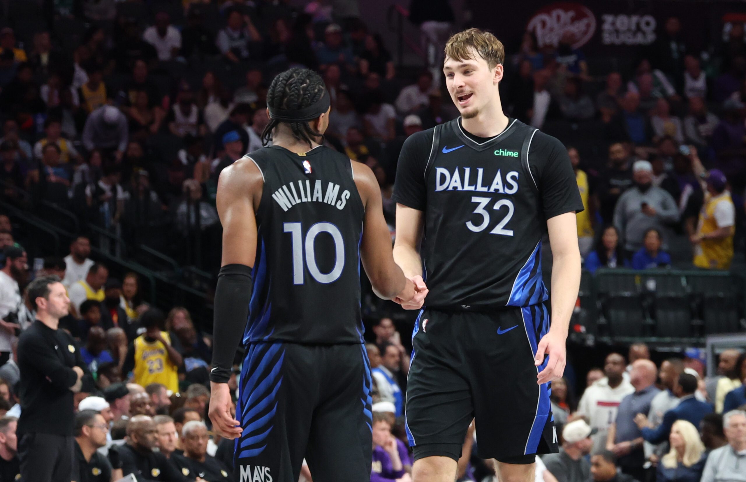 Apr 5, 2026; Dallas, Texas, USA;  Dallas Mavericks forward Cooper Flagg (32) celebrates with Dallas Mavericks guard Brandon Williams (10) during the second half against the Los Angeles Lakers at American Airlines Center. Mandatory Credit: Kevin Jairaj-Imagn Images