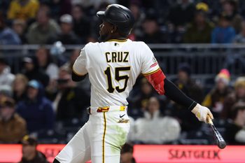 Apr 6, 2026; Pittsburgh, Pennsylvania, USA;  Pittsburgh Pirates center fielder Oneil Cruz (15) hits a single against the San Diego Padres during the fifth inning at PNC Park. Mandatory Credit: Charles LeClaire-Imagn Images