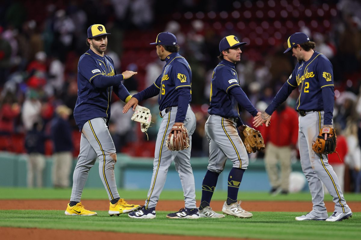 Apr 6, 2026; Boston, Massachusetts, USA; Milwaukee Brewers center fielder Garrett Mitchell (5) and Milwaukee Brewers right fielder Sal Frelick (10) celebrate after defeating the Boston Red Sox at Fenway Park. Mandatory Credit: Paul Rutherford-Imagn Images