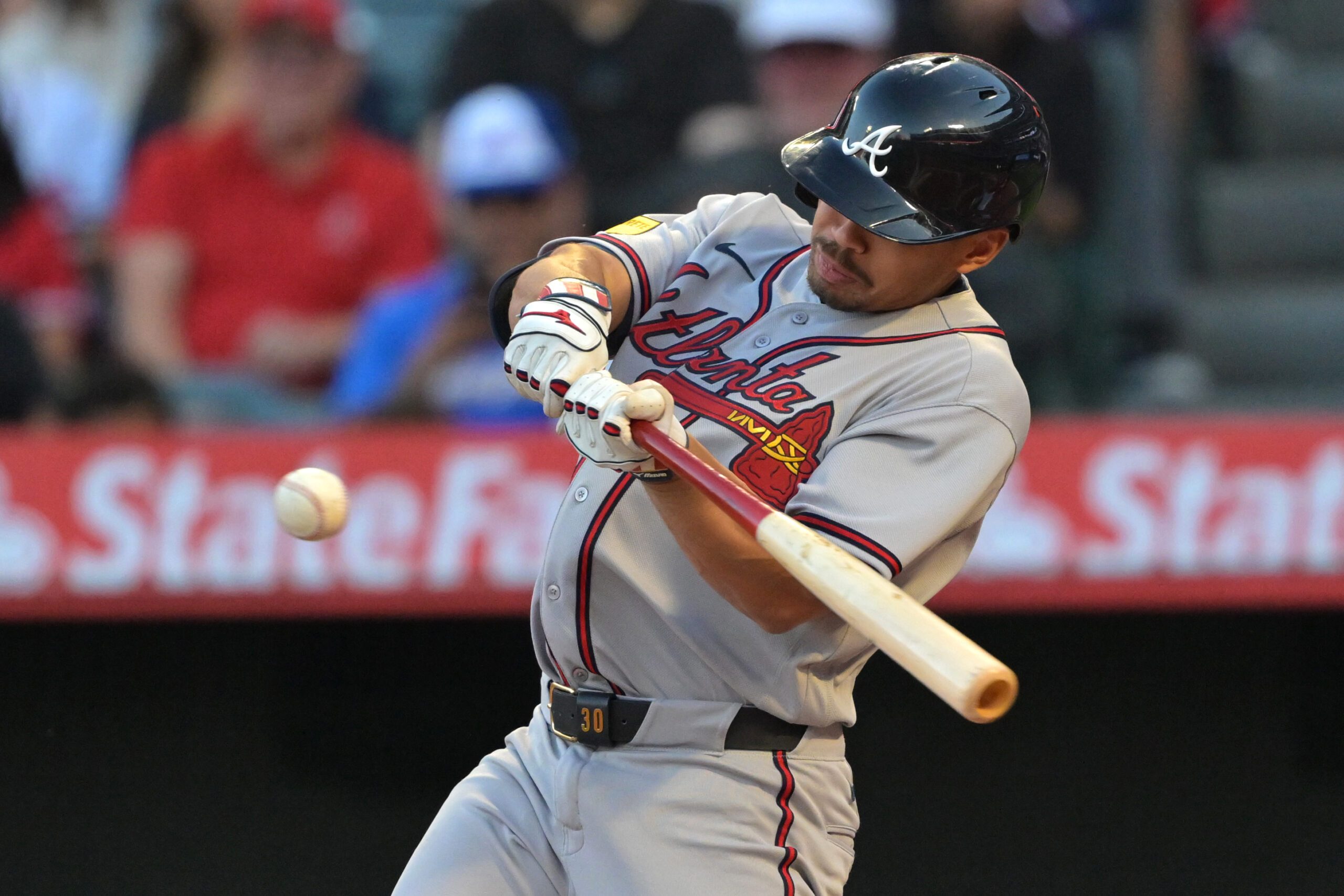 Apr 6, 2026; Anaheim, California, USA; Atlanta Braves catcher Drake Baldwin (30) hits a solo home run in the first inning against the Los Angeles Angels at Angel Stadium. Mandatory Credit: Jayne Kamin-Oncea-Imagn Images