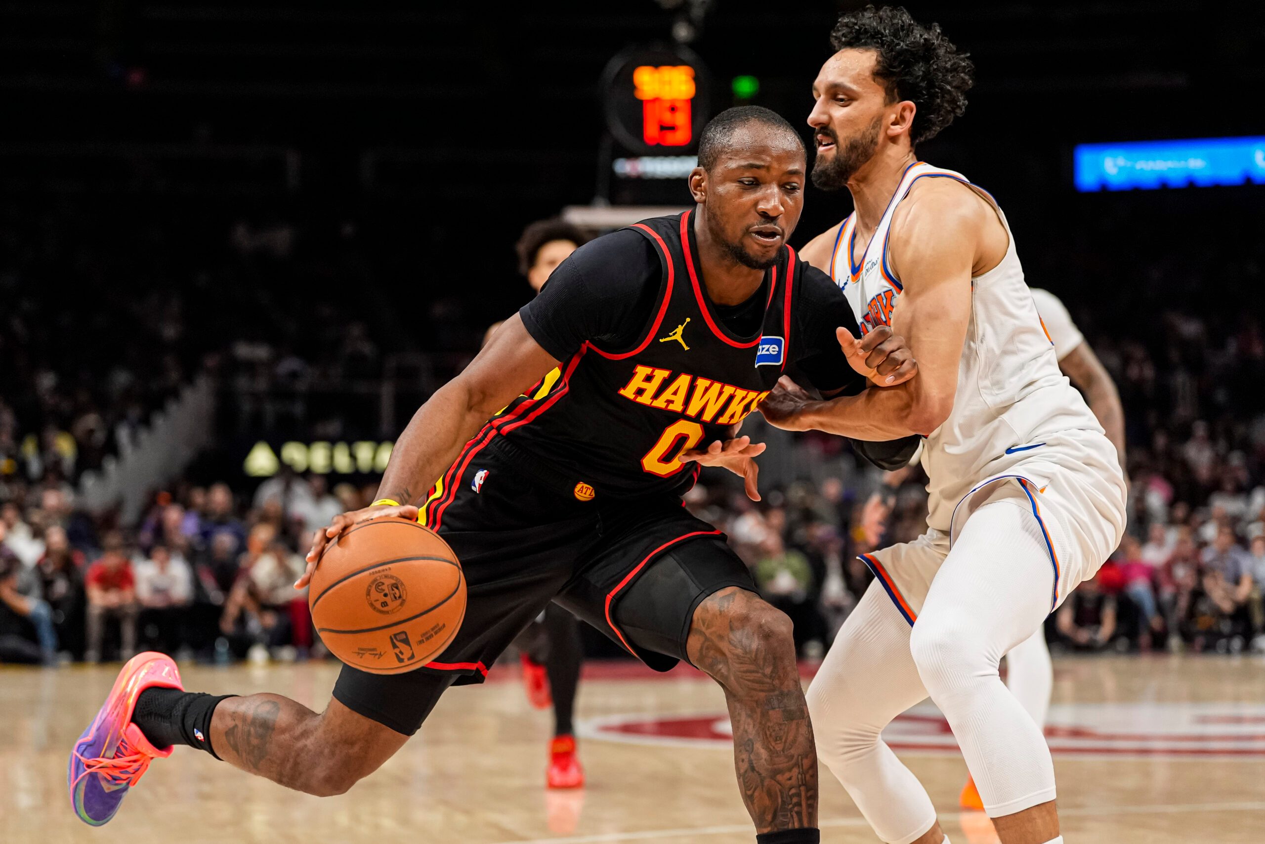 Apr 6, 2026; Atlanta, Georgia, USA; Atlanta Hawks forward Jonathan Kuminga (0) dribbles against New York Knicks guard Landry Shamet (44) during the second half at State Farm Arena. Mandatory Credit: Dale Zanine-Imagn Images