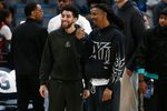 Apr 6, 2026; Memphis, Tennessee, USA; Memphis Grizzlies guard Scotty Pippen Jr. (left) and guard Ja Morant (right) talk after the game against the Cleveland Cavaliers at FedExForum. Mandatory Credit: Petre Thomas-Imagn Images