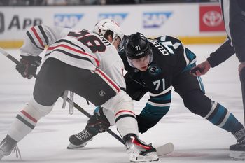 Apr 6, 2026; San Jose, California, USA;  San Jose Sharks center Macklin Celebrini (71) and Chicago Blackhawks center Connor Bedard (98) face off during the second period at SAP Center at San Jose. Mandatory Credit: David Gonzales-Imagn Images