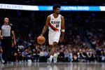 Apr 6, 2026; Denver, Colorado, USA; Portland Trail Blazers guard Scoot Henderson (00) dribbles the ball up court in the fourth quarter against the Denver Nuggets at Ball Arena. Mandatory Credit: Isaiah J. Downing-Imagn Images
