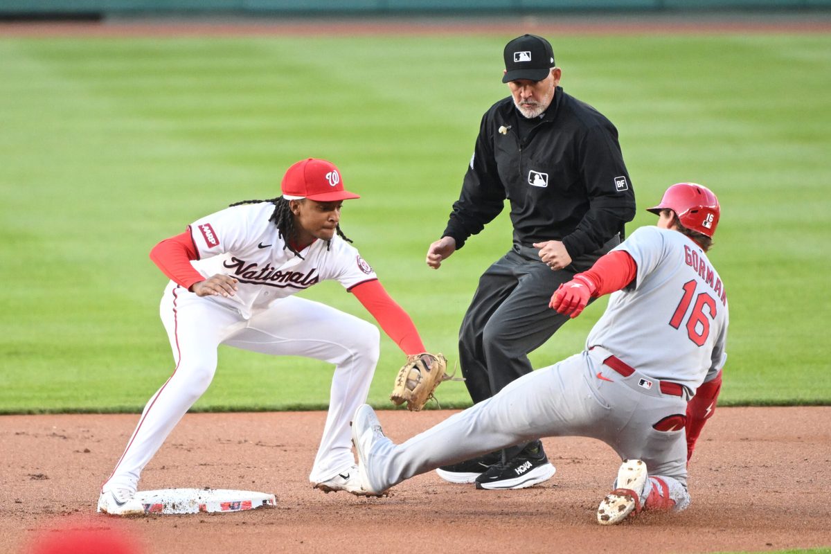 Apr 7, 2026; Washington, District of Columbia, USA; St. Louis Cardinals second baseman Nolan Gorman (16) is tagged out by Washington Nationals shortstop CJ Abrams (5) while trying to steal second base during the first inning at Nationals Park. Mandatory Credit: Rafael Suanes-Imagn Images
