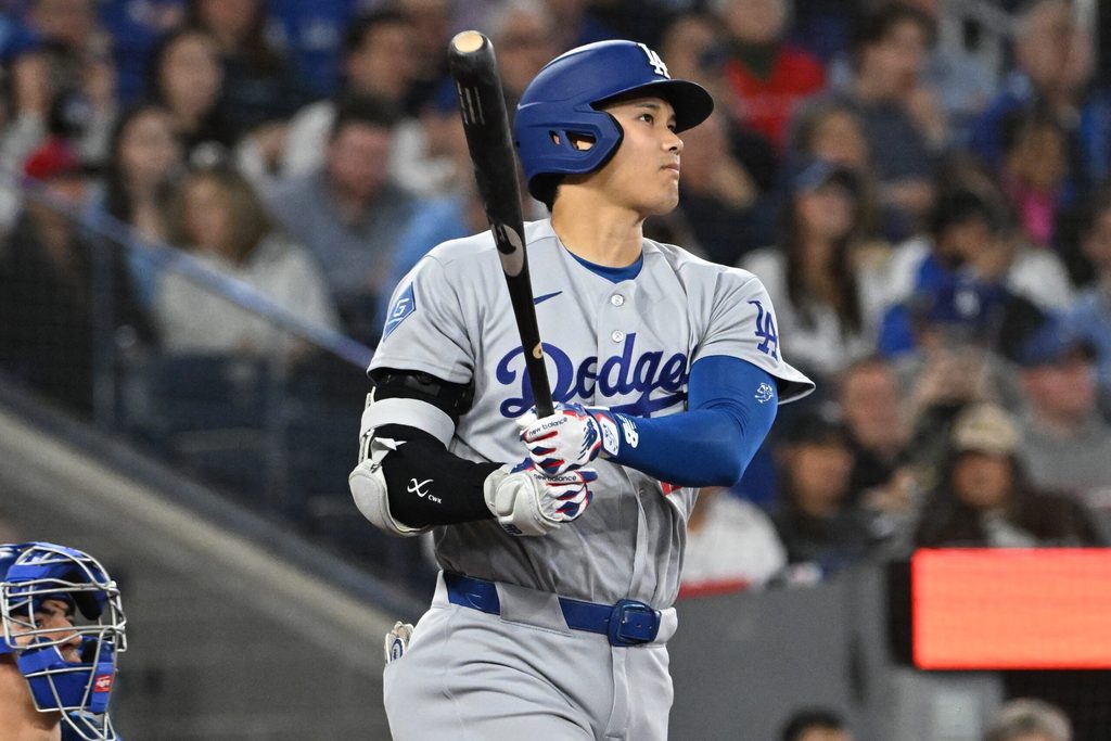 Apr 7, 2026; Toronto, Ontario, CAN; Los Angeles Dodgers designated hitter Shohei Ohtani (17) hits a single against the Toronto Blue Jays in the third inning at Rogers Centre. Mandatory Credit: Dan Hamilton-Imagn Images