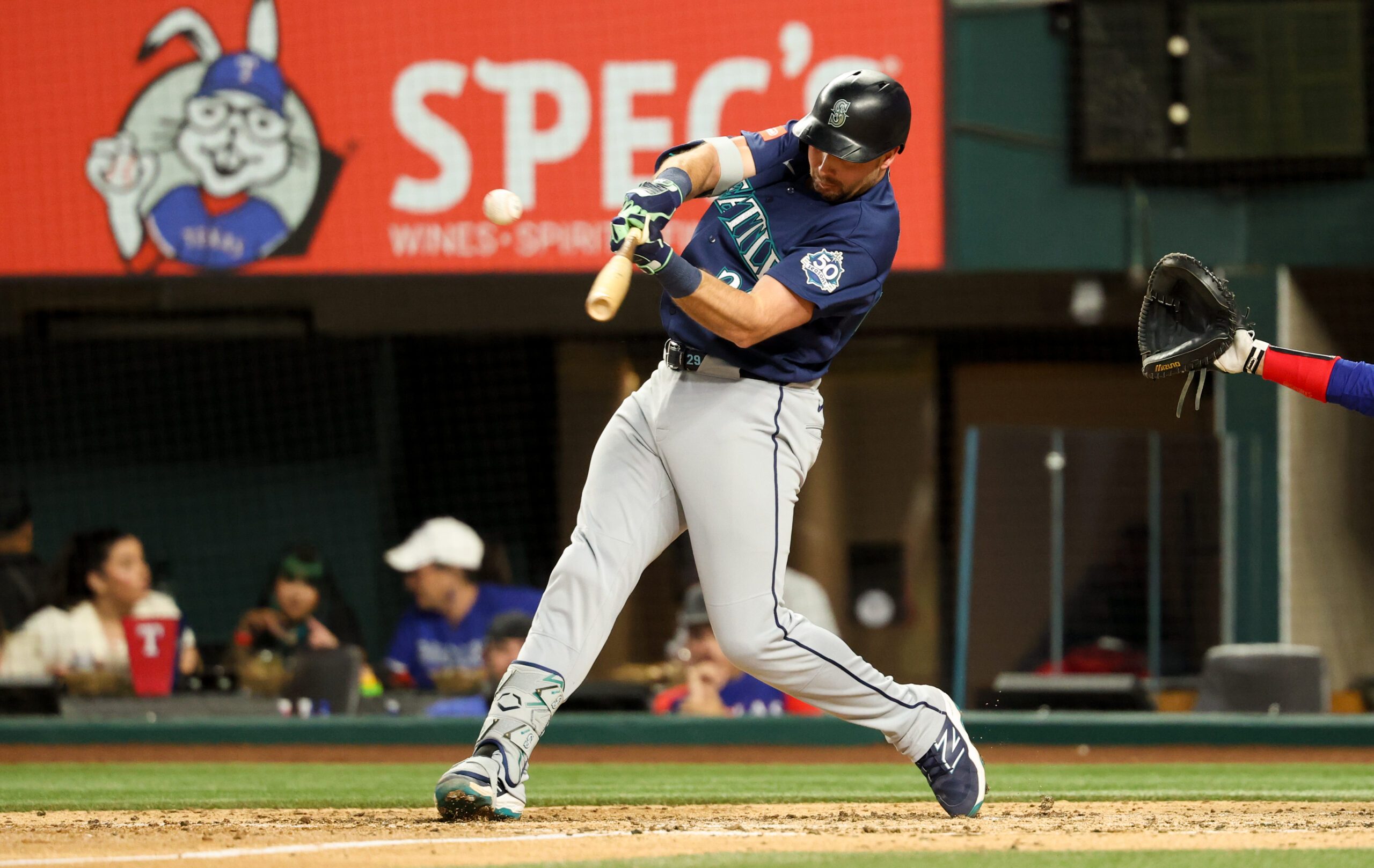 Apr 7, 2026; Arlington, Texas, USA; Seattle Mariners catcher Cal Raleigh (29) hits an rbi single during the fifth inning against the Texas Rangers at Globe Life Field. Mandatory Credit: Kevin Jairaj-Imagn Images
