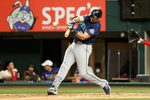 Apr 7, 2026; Arlington, Texas, USA; Seattle Mariners catcher Cal Raleigh (29) hits an rbi single during the fifth inning against the Texas Rangers at Globe Life Field. Mandatory Credit: Kevin Jairaj-Imagn Images