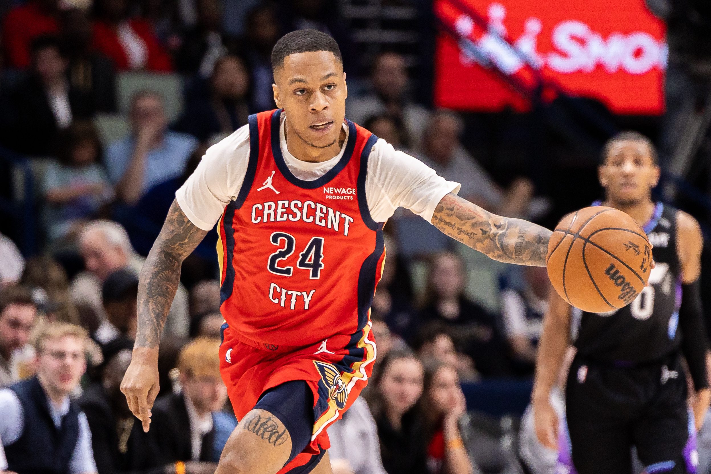 Apr 7, 2026; New Orleans, Louisiana, USA;  New Orleans Pelicans guard Jordan Hawkins (24) dribbles the ball court against the Utah Jazz during the first half at Smoothie King Center. Mandatory Credit: Stephen Lew-Imagn Images