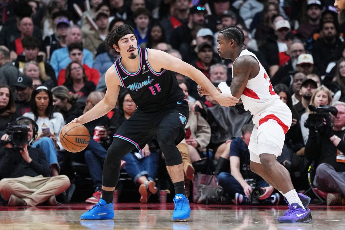 Apr 7, 2026; Toronto, Ontario, CAN; Miami Heat forward Jaime Jaquez Jr. (11) controls the ball as Toronto Raptors guard Jamal Shead (23) defends during the third quarter at Scotiabank Arena. Mandatory Credit: Nick Turchiaro-Imagn Images