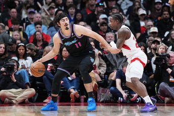 Apr 7, 2026; Toronto, Ontario, CAN; Miami Heat forward Jaime Jaquez Jr. (11) controls the ball as Toronto Raptors guard Jamal Shead (23) defends during the third quarter at Scotiabank Arena. Mandatory Credit: Nick Turchiaro-Imagn Images