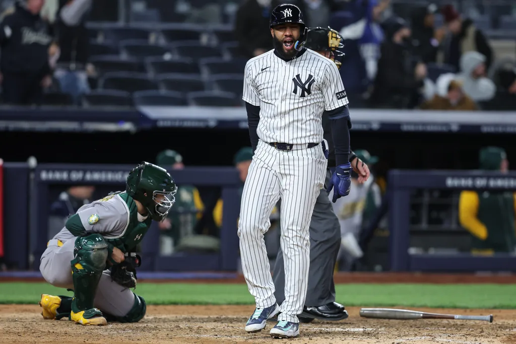 Apr 7, 2026; Bronx, New York, USA; New York Yankees third baseman Amed Rosario (14) hits a three run home run in the eighth inning against the Athletics at Yankee Stadium. Mandatory Credit: Wendell Cruz-Imagn Images