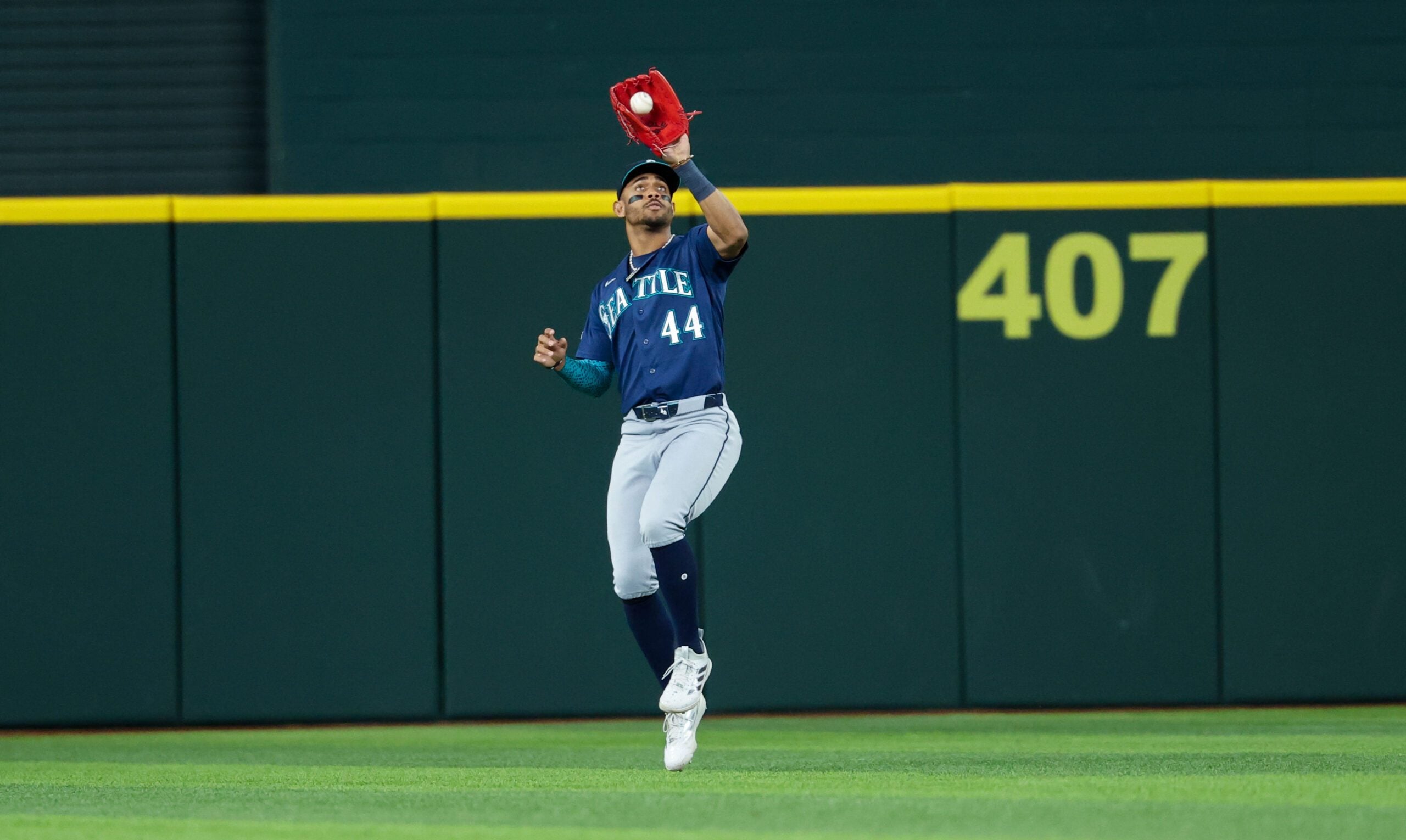 Apr 7, 2026; Arlington, Texas, USA; Seattle Mariners center fielder Julio Rodriguez (44) makes a catch during the seventh inning against the Texas Rangers at Globe Life Field. Mandatory Credit: Kevin Jairaj-Imagn Images