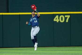 Apr 7, 2026; Arlington, Texas, USA; Seattle Mariners center fielder Julio Rodriguez (44) makes a catch during the seventh inning against the Texas Rangers at Globe Life Field. Mandatory Credit: Kevin Jairaj-Imagn Images