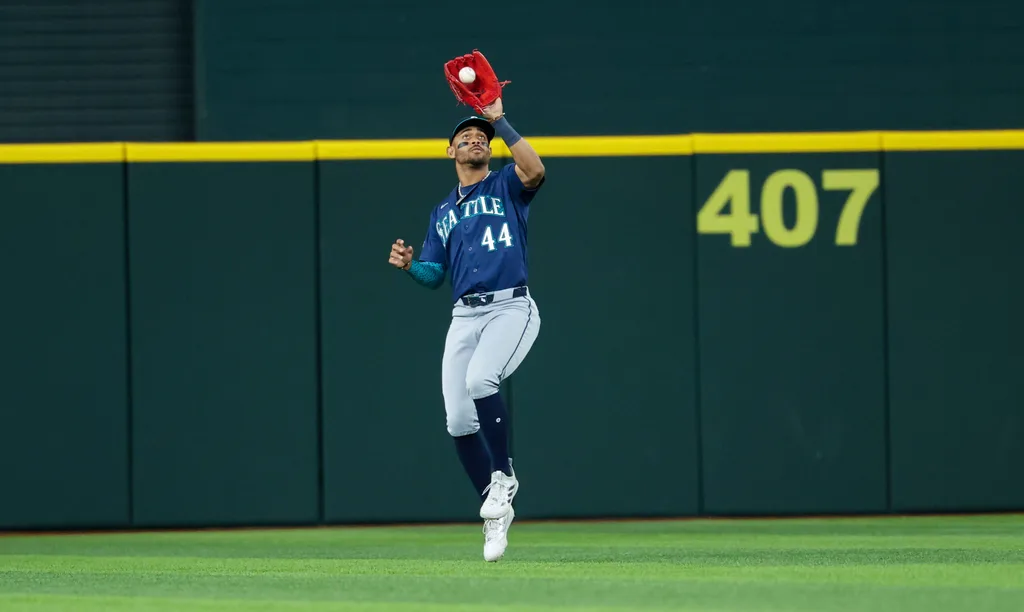 Apr 7, 2026; Arlington, Texas, USA; Seattle Mariners center fielder Julio Rodriguez (44) makes a catch during the seventh inning against the Texas Rangers at Globe Life Field. Mandatory Credit: Kevin Jairaj-Imagn Images