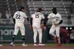 Apr 7, 2026; Minneapolis, Minnesota, USA; Minnesota Twins shortstop Brooks Lee (22) second baseman Luke Keaschall (15) and center fielder Byron Buxton (25) celebrate after defeating the Detroit Tigers at Target Field. Mandatory Credit: Jordan Johnson-Imagn Images