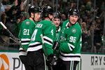 Apr 7, 2026; Dallas, Texas, USA; Dallas Stars defenseman Miro Heiskanen (4) and left wing Jason Robertson (21) and center Wyatt Johnston (53) and right wing Mikko Rantanen (96) celebrate after Johnston scores the game winning power-play goal against Calgary Flames goaltender Devin Cooley (not pictured) during the overtime period at the American Airlines Center. Mandatory Credit: Jerome Miron-Imagn Images