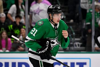 Apr 7, 2026; Dallas, Texas, USA; Dallas Stars left wing Jason Robertson (21) skates with plugs in his nose after he is hit with the high stick o Calgary Flames center Ryan Strome (not pictured) during the overtime period at the American Airlines Center. Mandatory Credit: Jerome Miron-Imagn Images