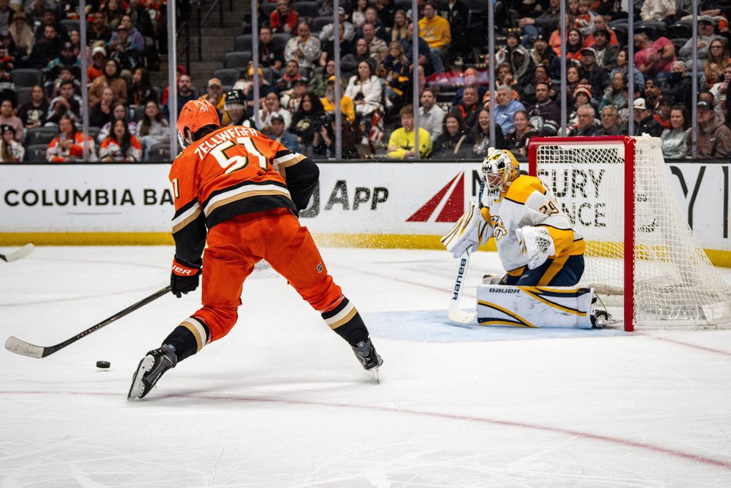 Apr 4, 2026; Anaheim, California, USA; Anaheim Ducks defenseman Olen Zellweger (51) takes a shot on goal during the second period against the Nashville Predators at Honda Center. Mandatory Credit: Corinne Votaw-Imagn Images