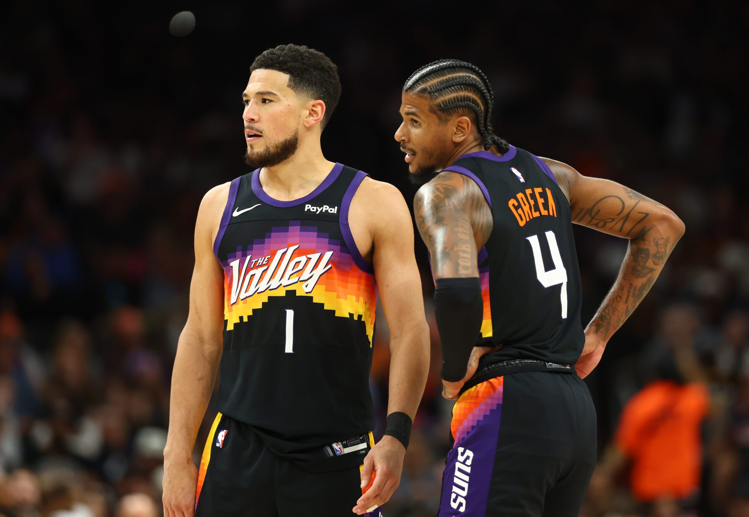 Apr 7, 2026; Phoenix, Arizona, USA; Phoenix Suns guard Devin Booker (1) and Jalen Green (4) against the Houston Rockets in the second half at Mortgage Matchup Center. Mandatory Credit: Mark J. Rebilas-Imagn Images