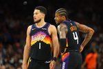 Apr 7, 2026; Phoenix, Arizona, USA; Phoenix Suns guard Devin Booker (1) and Jalen Green (4) against the Houston Rockets in the second half at Mortgage Matchup Center. Mandatory Credit: Mark J. Rebilas-Imagn Images