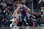 Apr 7, 2026; San Francisco, California, USA;  Sacramento Kings center Maxime Raynaud (42) dribbles against Golden State Warriors guard Pat Spencer (61) in the third quarter at Chase Center. Mandatory Credit: David Gonzales-Imagn Images