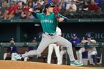 Apr 8, 2026; Arlington, Texas, USA;  Seattle Mariners pitcher Bryan Woo (22) throws to the plate during the first inning against the Texas Rangers at Globe Life Field. Mandatory Credit: Raymond Carlin III-Imagn Images
