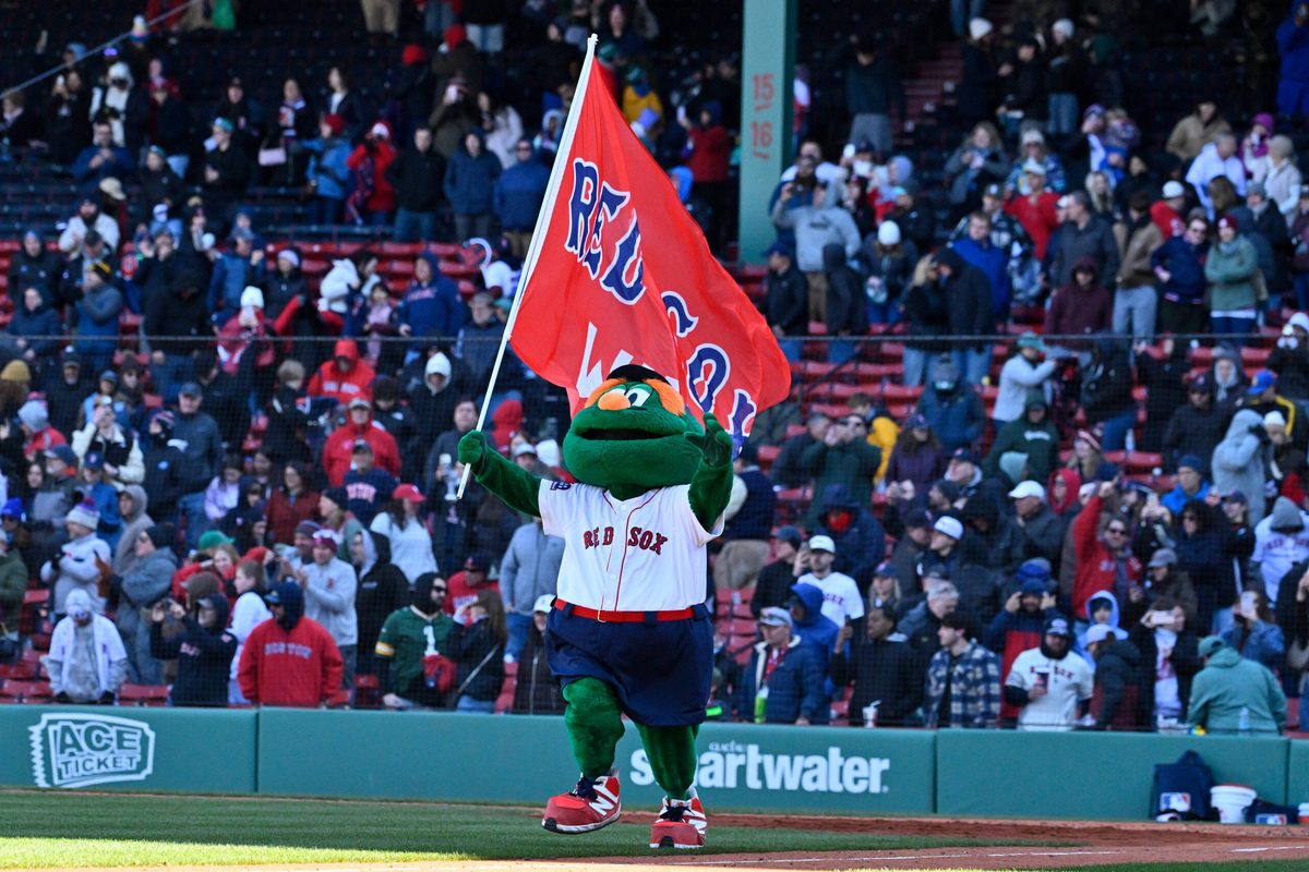 Apr 8, 2026; Boston, Massachusetts, USA; Wally the Boston Red Sox mascot celebrates the team's victory against the Milwaukee Brewers at Fenway Park. Mandatory Credit: Eric Canha-Imagn Images