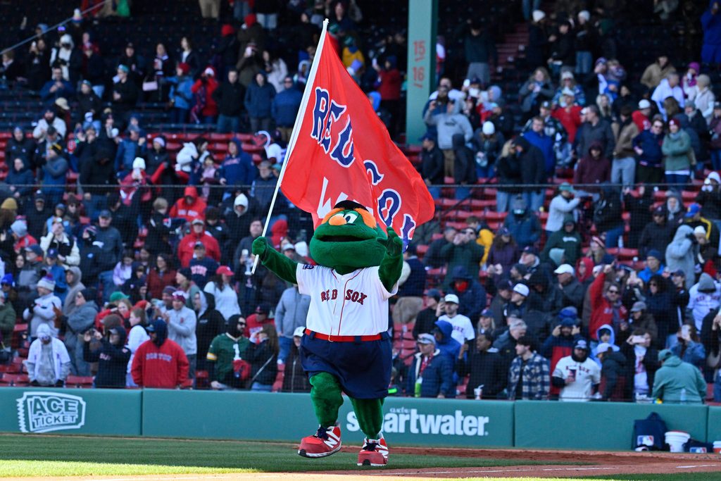 Apr 8, 2026; Boston, Massachusetts, USA; Wally the Boston Red Sox mascot celebrates the team's victory against the Milwaukee Brewers at Fenway Park. Mandatory Credit: Eric Canha-Imagn Images