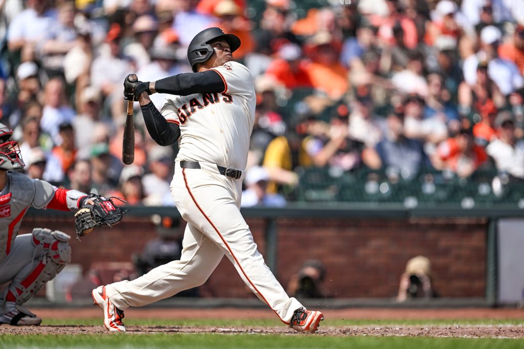 Apr 8, 2026; San Francisco, California, USA; San Francisco Giants designated hitter Rafael Devers (16) hits a three-run home run in the bottom of the sixth inning against Philadelphia Phillies pitcher Aaron Nola (27) at Oracle Park. Mandatory Credit: Justine Willard-Imagn Images
