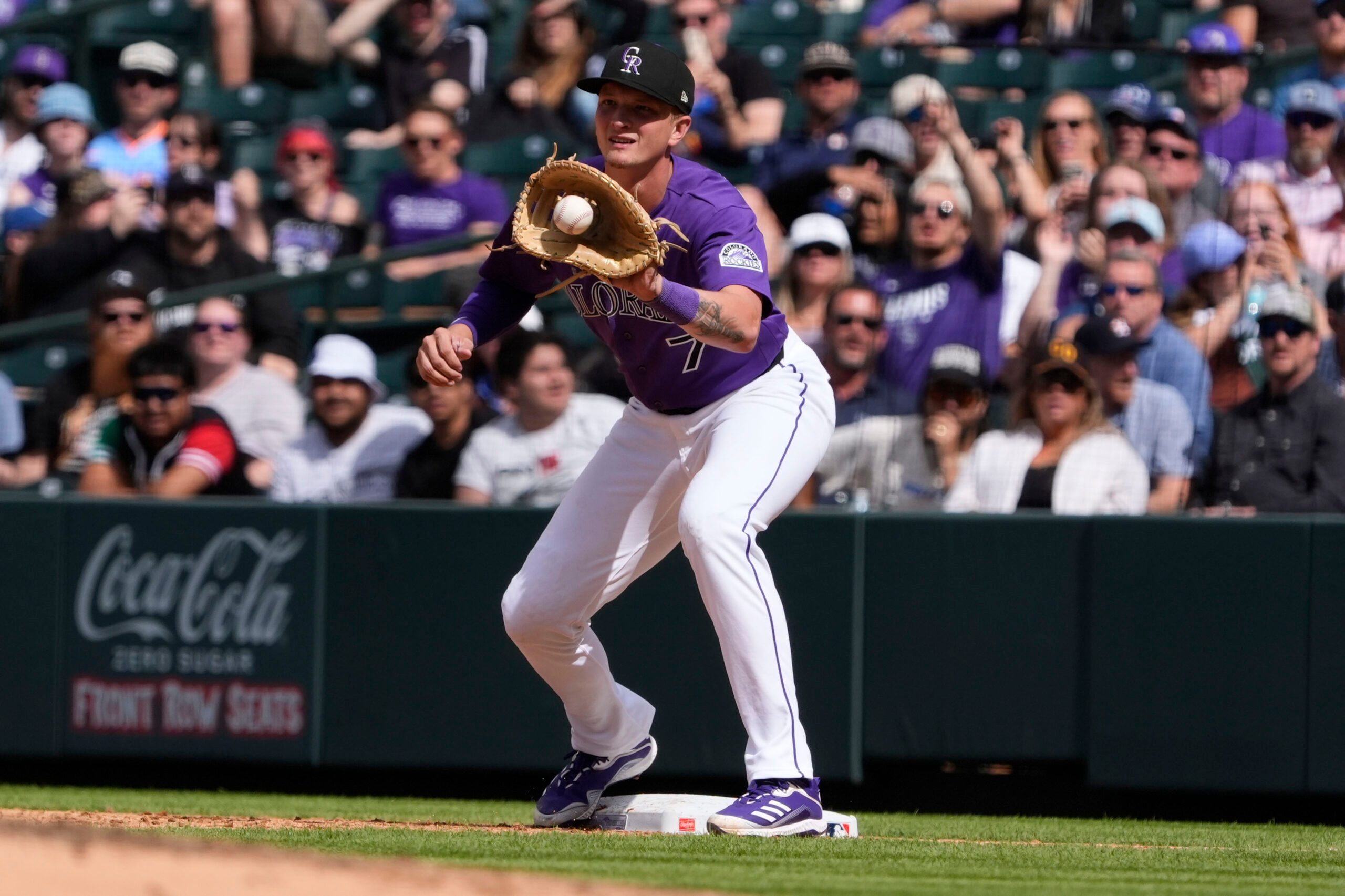Apr 8, 2026; Denver, Colorado, USA; Colorado Rockies first baseman TJ Rumfield (7) fields the ball in the fifth inning against the Houston Astros delivers a pitch at Coors Field. Mandatory Credit: Ron Chenoy-Imagn Images