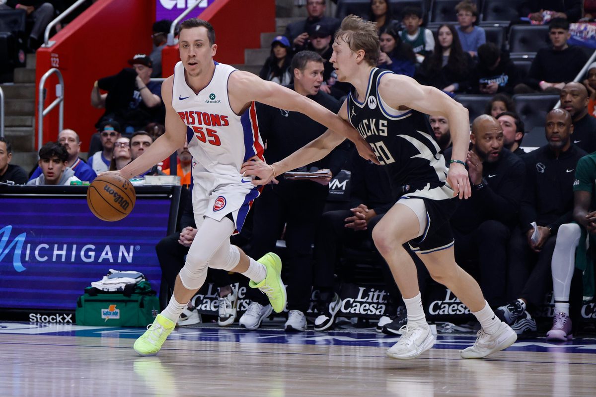 Apr 08, 2026; Detroit, Michigan, USA; Detroit Pistons forward Duncan Robinson (55) dribbles defended by Milwaukee Bucks guard AJ Green (20) in the second half at Little Caesars Arena. Mandatory Credit: Rick Osentoski-Imagn Images