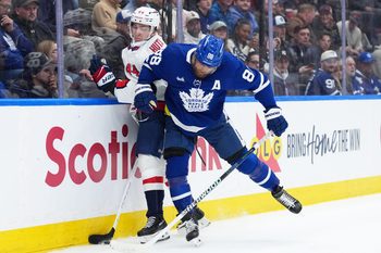 Apr 8, 2026; Toronto, Ontario, CAN; Washington Capitals defenceman Cole Hutson (44) battles along the boards with Toronto Maple Leafs right wing William Nylander (88) during the third period at Scotiabank Arena. Mandatory Credit: Nick Turchiaro-Imagn Images
