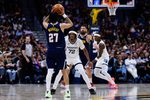 Apr 8, 2026; Denver, Colorado, USA; Denver Nuggets guard Jamal Murray (27) controls the ball against Memphis Grizzlies guard Adama Bal (72) as center Jonas Valanciunas (17) and forward Taylor Hendricks (22) battle for position in the fourth quarter at Ball Arena. Mandatory Credit: Isaiah J. Downing-Imagn Images