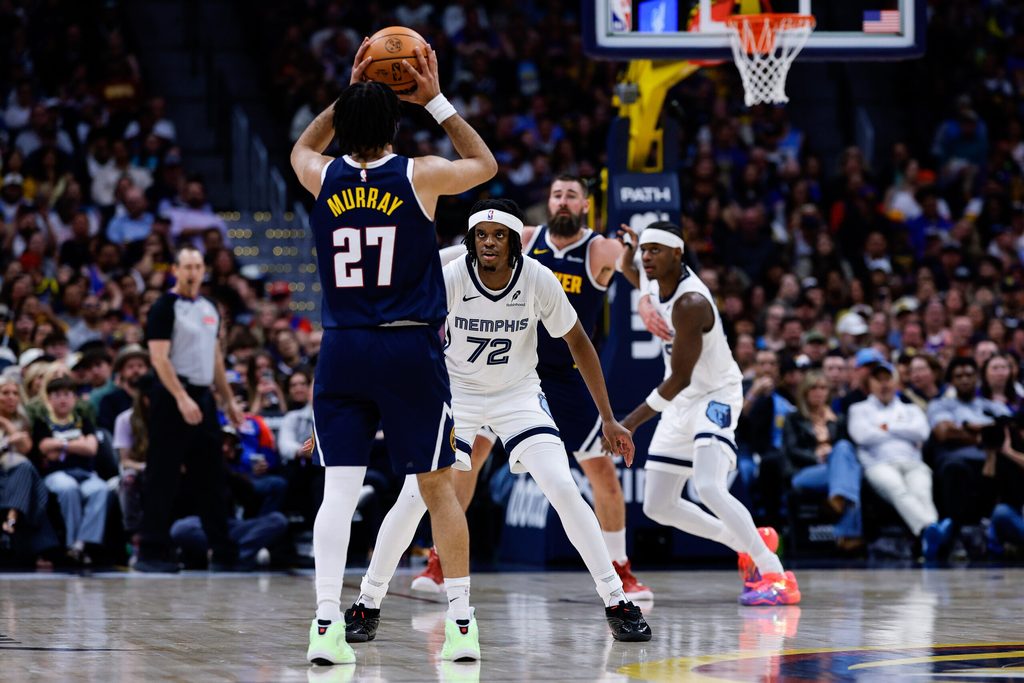 Apr 8, 2026; Denver, Colorado, USA; Denver Nuggets guard Jamal Murray (27) controls the ball against Memphis Grizzlies guard Adama Bal (72) as center Jonas Valanciunas (17) and forward Taylor Hendricks (22) battle for position in the fourth quarter at Ball Arena. Mandatory Credit: Isaiah J. Downing-Imagn Images