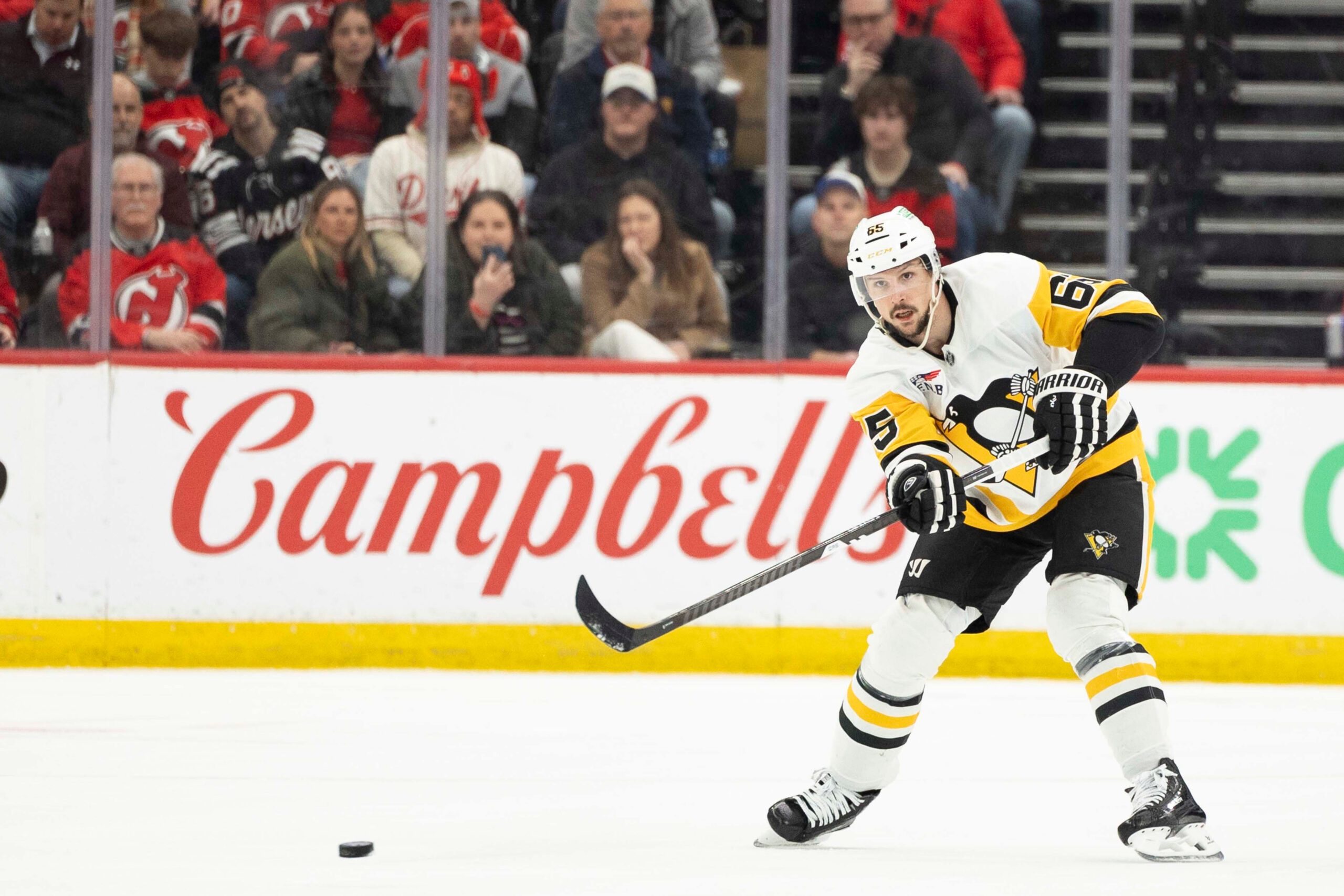Apr 9, 2026; Newark, New Jersey, USA; Pittsburgh Penguins defenseman Erik Karlsson (65) passes the puck against the New Jersey Devils during the first period at Prudential Center. Mandatory Credit: Luther Schlaifer-Imagn Images