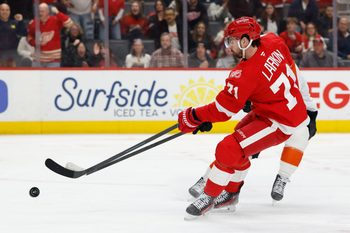 Mar 28, 2026; Detroit, Michigan, USA;  Detroit Red Wings center Dylan Larkin (71) skates with the puck in the second period against the Philadelphia Flyers at Little Caesars Arena. Mandatory Credit: Rick Osentoski-Imagn Images