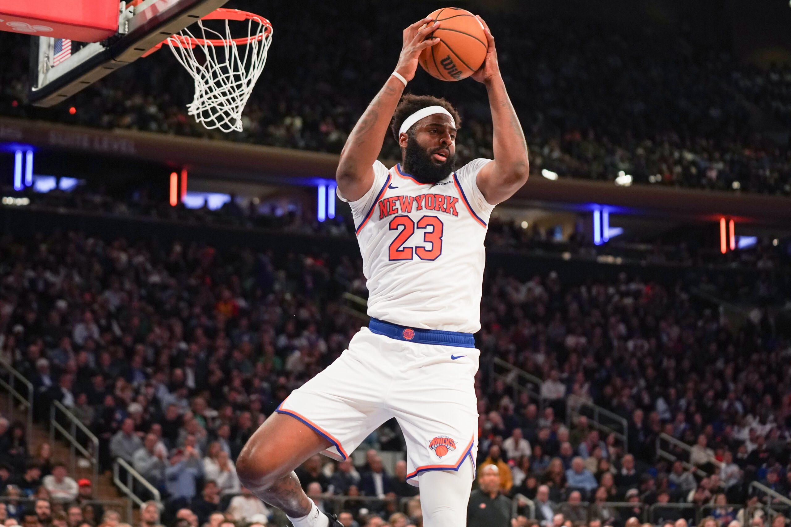 Apr 9, 2026; New York, New York, USA; New York Knicks center Mitchell Robinson (23) secures a rebound during the fourth quarter against the Boston Celtics at Madison Square Garden. Mandatory Credit: Lucas Boland-Imagn Images