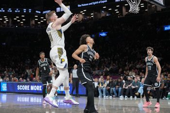Apr 9, 2026; Brooklyn, New York, USA; Indiana Pacers center Micah Potter (11) shoots the ball against Brooklyn Nets forward Jalen Wilson (22) during the second half at Barclays Center. Mandatory Credit: Gregory Fisher-Imagn Images