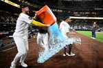 Apr 9, 2026; San Diego, California, USA; San Diego Padres center fielder Jackson Merrill (3) attempts to pour the contents of a beverage cooler over shortstop Xander Bogaerts (2) after Bogaerts hit a walk-off grand slam home run in the twelfth inning against the Colorado Rockies at Petco Park. Mandatory Credit: Denis Poroy-Imagn Images
